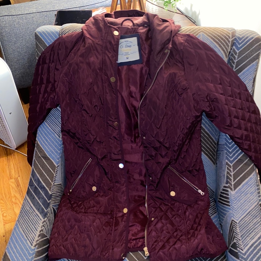 Burgundy quilted jacket.